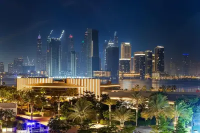 a view of a city skyline at night at Goldbest - Seven Palm 4ppl in Dubai