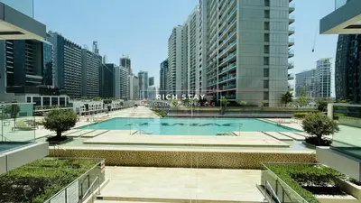 a swimming pool in a city with tall buildings at Modern loft Studio in Damac Majestine,Business Bay in Dubai
