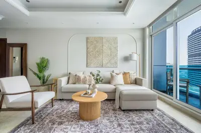 a living room with a couch and a table at GuestReady - Stunning hideaway in Dubai Marina in Dubai