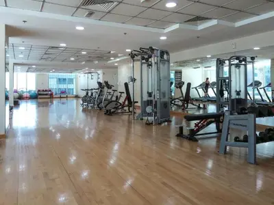 a gym with treadmills and machines in a room at Stunning 1 Bedroom Apartment in Dubai Marina in Dubai