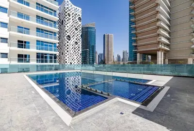 a swimming pool in the middle of a building at Stunning High Floor Studio Apartment in BusinessBay in Dubai