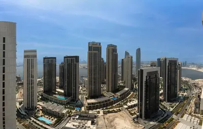 an aerial view of a city with tall buildings at Chic 2BD in Dubai Creek Harbour with Infinity Pool in Dubai