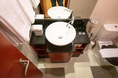 a bathroom with a sink and a toilet at Cozy Studio Apartment in DIFC in Dubai