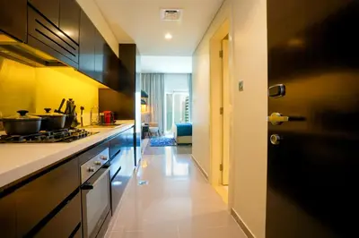 a kitchen with a stove and a counter top at Majestine business bay in Dubai