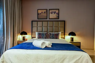 a bedroom with a bed with a towel on it at Majestine business bay in Dubai