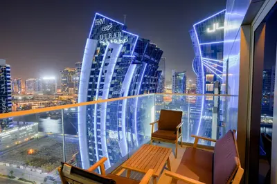 a room with a view of a city at night at Majestine business bay in Dubai