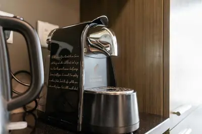 a tea kettle sitting on a counter in a microwave at New Ultimate Stay 5 min walk from Dubai Mall Lofts Tower 5 pax in Dubai