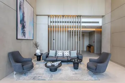 a living room with two chairs and a couch at STAY BY LATINEM Luxury 2BR Holiday Home W204 near Burj Khalifa in Dubai