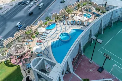 an overhead view of a pool at a resort at Comfy Studio Apartment in DIFC in Dubai