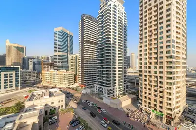 an aerial view of a city with tall buildings at FIRST CLASS Studio Luxe Serenity Retreat in Dubai