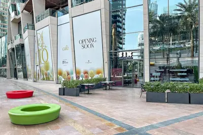 a large building with a green bowl in front of it at Luxury 4BR Flat, Downtown Dubai, Pool, Gym, PS5, Sleeps 11 Guests in Dubai