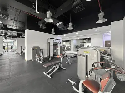 a gym with lots of cardio equipment in a room at FIRST CLASS 1BR Luxury Living in DIFC in Dubai