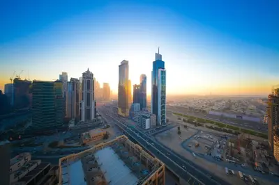 an aerial view of a city with tall buildings at PrimeForte Walk to Dubai Mall in Dubai