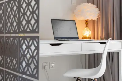 a desk with a laptop and a chair at Luxurious Living 3 Bedroom at Harbour Views in Dubai
