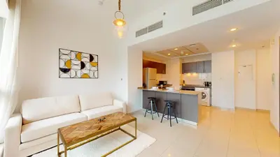 a living room with a couch and a table at Bay Central 2 - Charming One Bedroom in Dubai