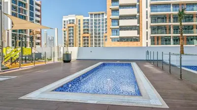 a swimming pool in the middle of a building at Azizi Riviera 46 - Cosy Studio in Dubai
