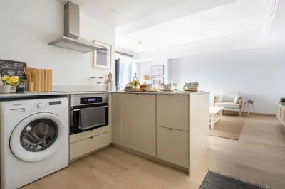 a kitchen with a washer and a washing machine at Frank Porter - Goldcrest Views 2 in Dubai