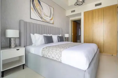 a bedroom with a large white bed in a room at Frank Porter - Aykon City Tower C in Dubai