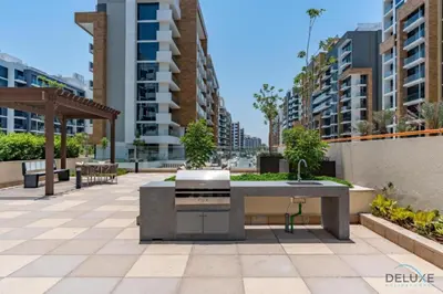 a patio with a fountain in the middle of a city at Comfortable Studio in Azizi Riviera 24, Al Merkadh by Deluxe Holiday Homes in Dubai