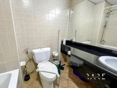 a bathroom with a toilet and a sink at Rare Holiday Homes - Mediterranean Cluster - Near Ibn Battuta Mall - Discovery Garden - Building# Med 49 - R505 in Dubai