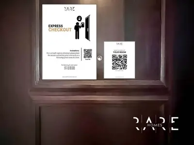 two posters on a door in a room at Rare Holiday Homes - Mediterranean Cluster - Near Ibn Battuta Mall - Discovery Garden - Building# Med 49 - R106 in Dubai