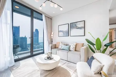 a living room with a couch and a table at Waterfront Living 2BR Apartment in Marina Star, Dubai Marina by Deluxe Holiday Homes in Dubai