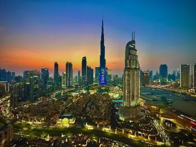 a city skyline at night with a lot of tall buildings at Breathtaking Burj View, Sky High Luxury 2BR Apartment by 2nd Best Home in Dubai