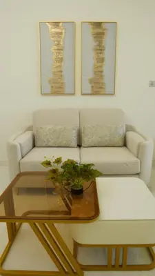 a living room with a couch and a coffee table at Dimorelux l Club Vista Mare l Five Palm Jumeirah in Dubai