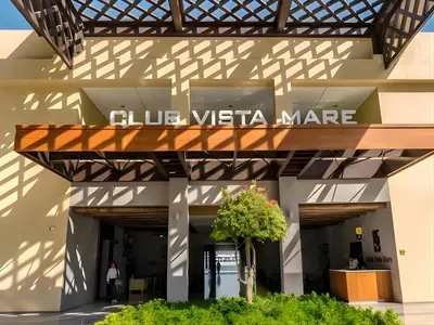a building with a sign that reads club vista mare at Dimorelux l Club Vista Mare l Five Palm Jumeirah in Dubai