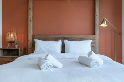 a white bed with towels on top of it at Boulevard 2 BR- Burj Khalifa-Dubai Mall- pool-Gym in Dubai