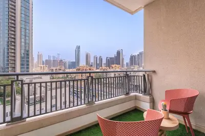 a balcony with chairs and a view of the city at Boulevard 2 BR- Burj Khalifa-Dubai Mall- pool-Gym in Dubai