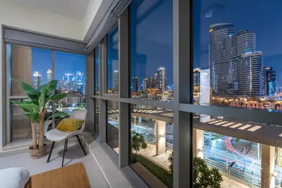 a room with a view of a city skyline at Boulevard 2 BR- Burj Khalifa-Dubai Mall- pool-Gym in Dubai