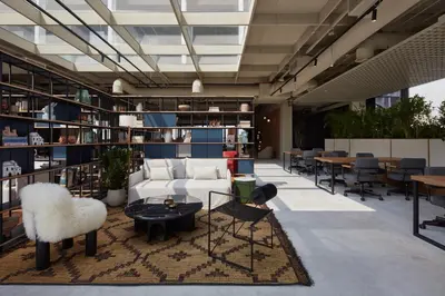 a living room with a couch and a table at Modern Studio at Upside Living, Business Bay with Burj Khalifa View in Dubai