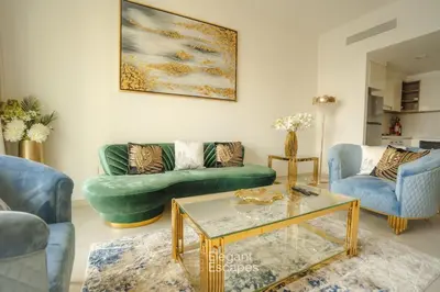 a living room with couches and a coffee table at Stylish 2 BR Apt, Amazing Fountains and Burj Views in Dubai