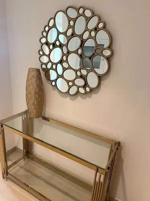 a glass shelf with a sculpture on the wall at Stylish 2 BR Apt, Amazing Fountains and Burj Views in Dubai