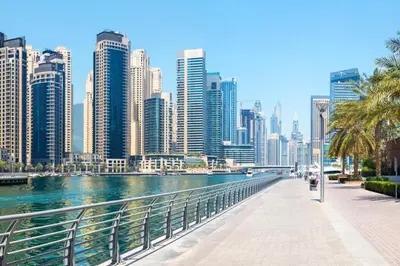 a river in a city with tall buildings at Blueground Marina Pool Gym DXB-221 in Dubai