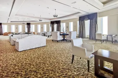 a large room with couches and chairs and a table at Blueground Marina Pool Gym DXB-237 in Dubai