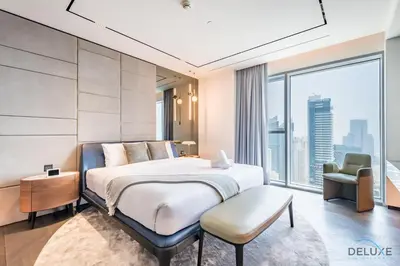 a bedroom with a large bed and a large window at Picturesque 3BR with Assistant Room in The One JBR by Deluxe Holiday Homes in Dubai