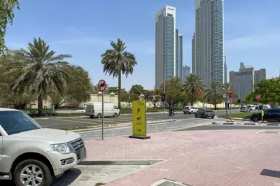 a white truck parked on a street in a city at Blueground DIFC indoor pool fitness center DXB-1515 in Dubai