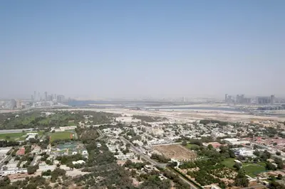 an aerial view of a city and a river at Blueground DIFC Burj K view pool fitness DXB-1535 in Dubai