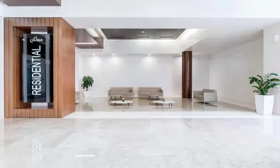 a lobby with chairs and tables in a building at Blueground DIFC Burj K view pool fitness DXB-1535 in Dubai
