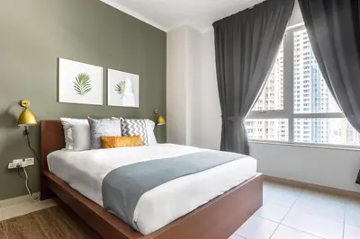 a bedroom with a bed and a large window at Blueground Downtown B Khalifa view pool DXB-645 in Dubai