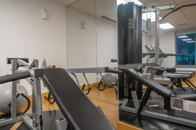 a fitness room with a treadmill and a monitor at Bellavista 1 Bedroom Full Burj Khalifa View 29 Boulevard Downtown Dubai in Dubai