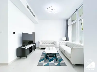 a white living room with a white couch and a piano at Luxury 3-Bedroom Duplex in Damac Hills & balcony in Dubai