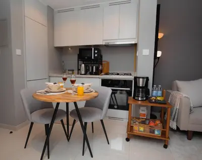 a kitchen with a table and chairs in a kitchen at Canal Vista - Home near Downtown - Awsesome views in Dubai