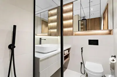 a bathroom with a sink and a toilet at Cosy 1bedroom apartment with pool gym game room in Dubai