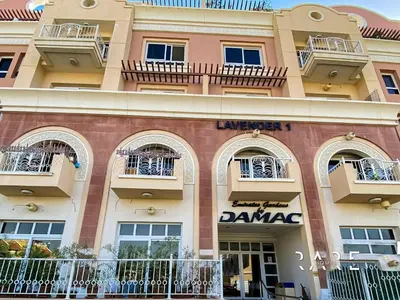 a building with balconies on the side of it at Rare Holiday Homes - Near Miracle Garden - Lavender 2 - RG012 - Jumeirah Village Circle in Dubai