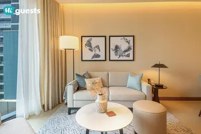 a living room with a couch and a table at HiGuests - Sky-High Experience Luxe Living on the 24th Floor in Dubai