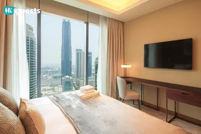 a hotel room with a bed and a large window at HiGuests - Sky-High Experience Luxe Living on the 24th Floor in Dubai