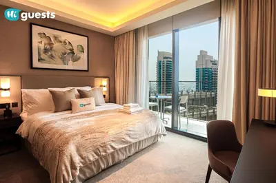 a bedroom with a large bed and a large window at HiGuests - Sky-High Experience Luxe Living on the 24th Floor in Dubai